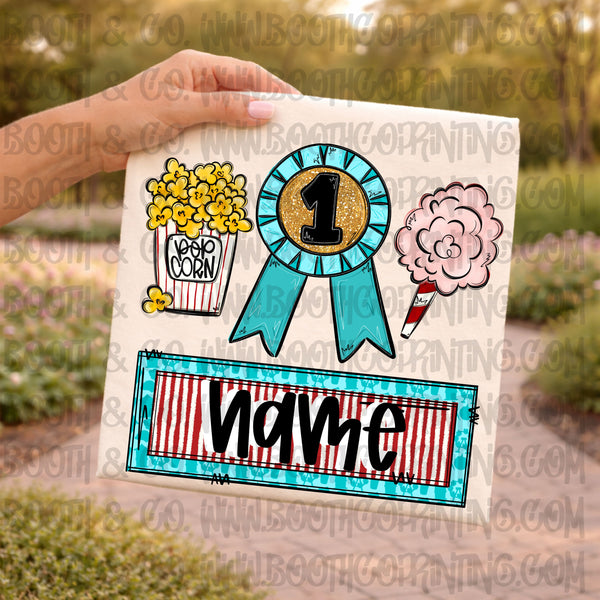Fair trio popcorn, prize ribbon and cotton candy with name plate girl